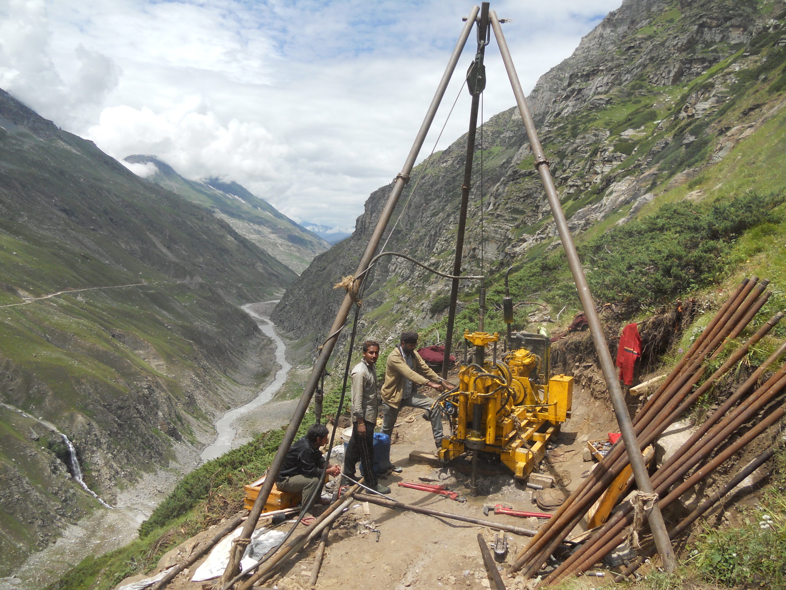 Sood & Company core drilling rig and drill rods on a Himalayan hillside site